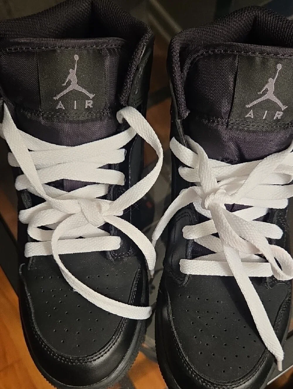 Jordan Kids Black and White High-Top Sneakers